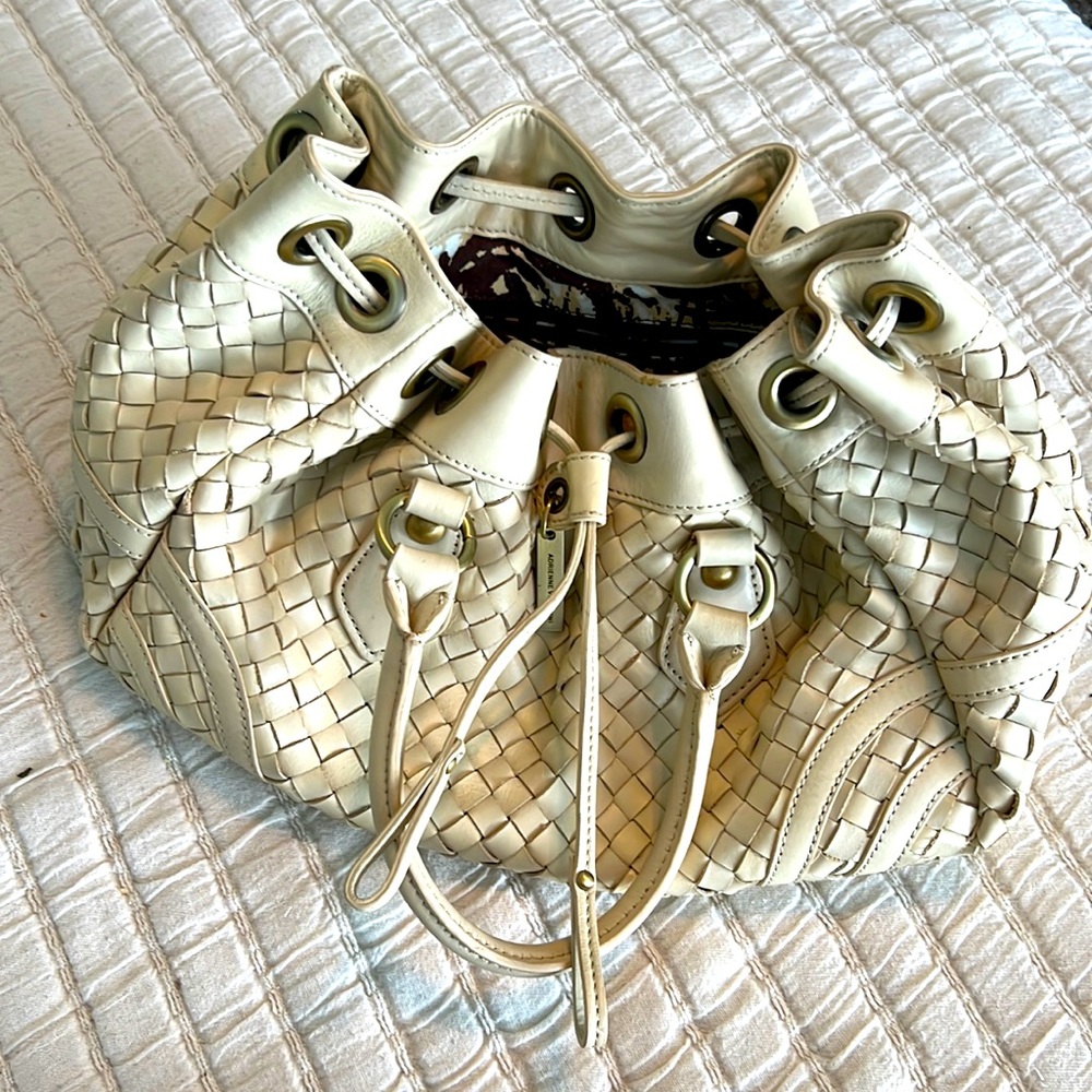 Beautiful braided leather hand bag. Like new condition.